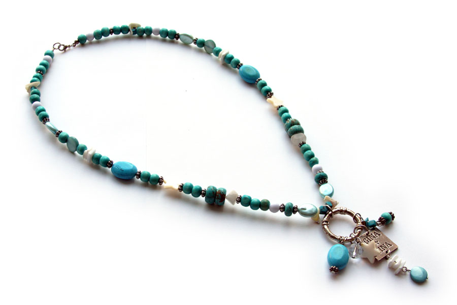 Necklace in shades of turquoise, stone, wood and mother of pearl
